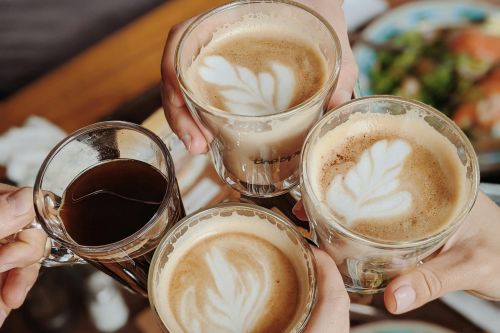 Enjoying delicious coffee with friends, perfect morning moment.