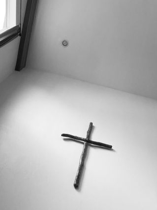 The cross symbolizing the crucifixion of Jesus in the Christian faith.